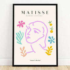 Framed abstract line art poster of a face with colorful floral and leaf shapes, modern wall decor