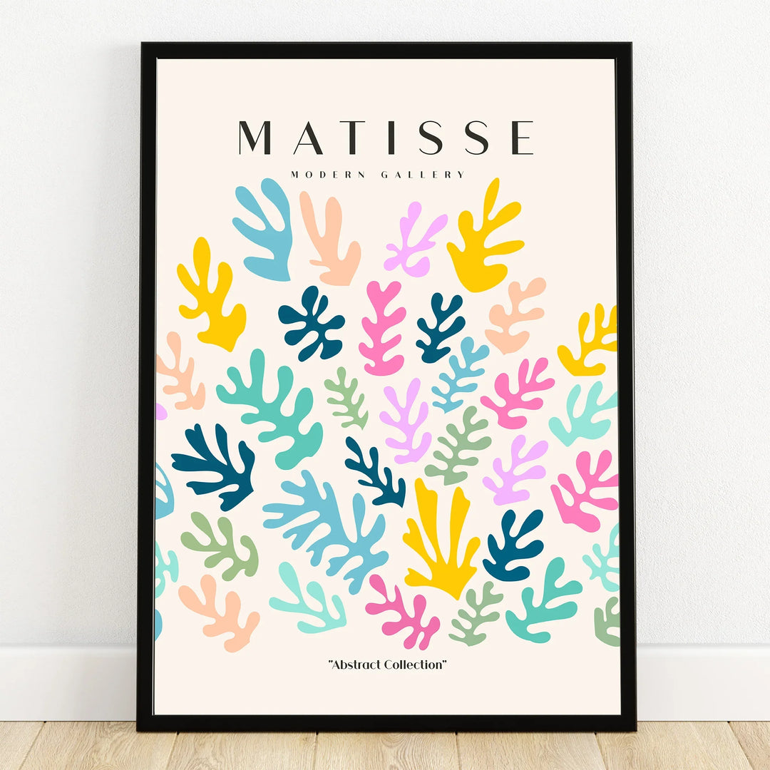 Framed abstract Matisse-inspired wall art with colorful cut-out leaf shapes on a light background