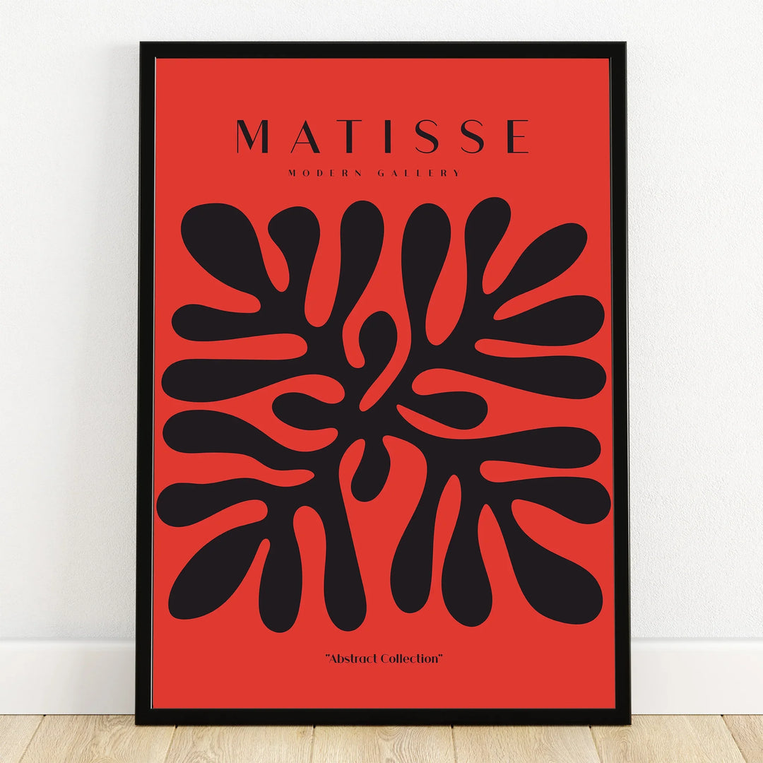 Abstract black organic shapes on red modern wall art print in black frame, inspired by Matisse