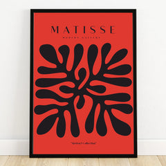 Abstract black organic shapes on red modern wall art print in black frame, inspired by Matisse