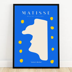 Modern abstract art poster with blue background, beige shape, and yellow dots in black frame