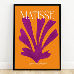 Matisse inspired wall art with bold purple cutout on orange background in black frame