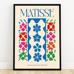 Colorful Matisse-style abstract art print in black frame, featuring floral shapes and bold colors