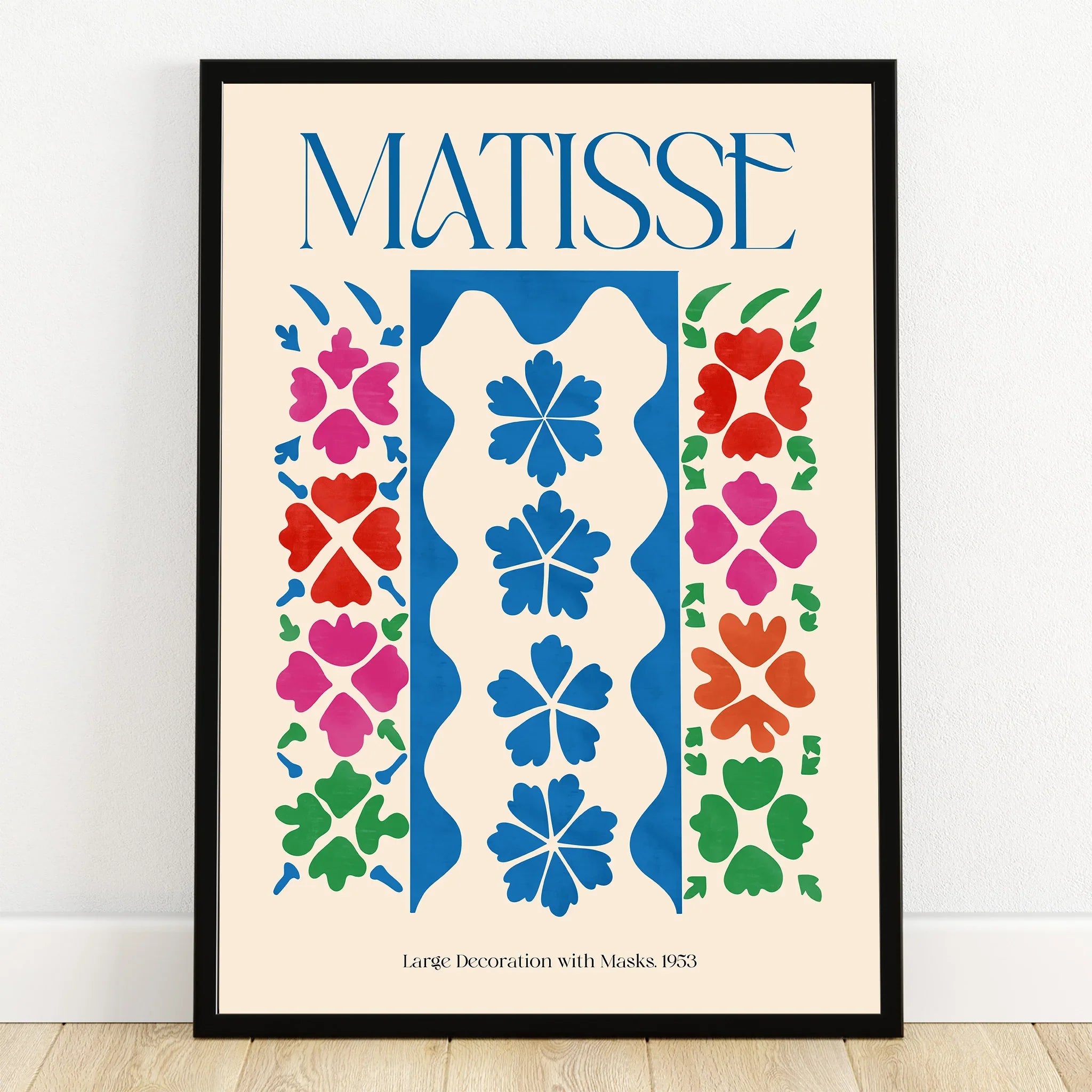 Colorful Matisse-style abstract art print in black frame, featuring floral shapes and bold colors
