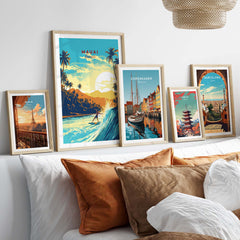 Vibrant Maui Hawaii surf print and travel posters displayed on a cozy bed with decorative pillows.