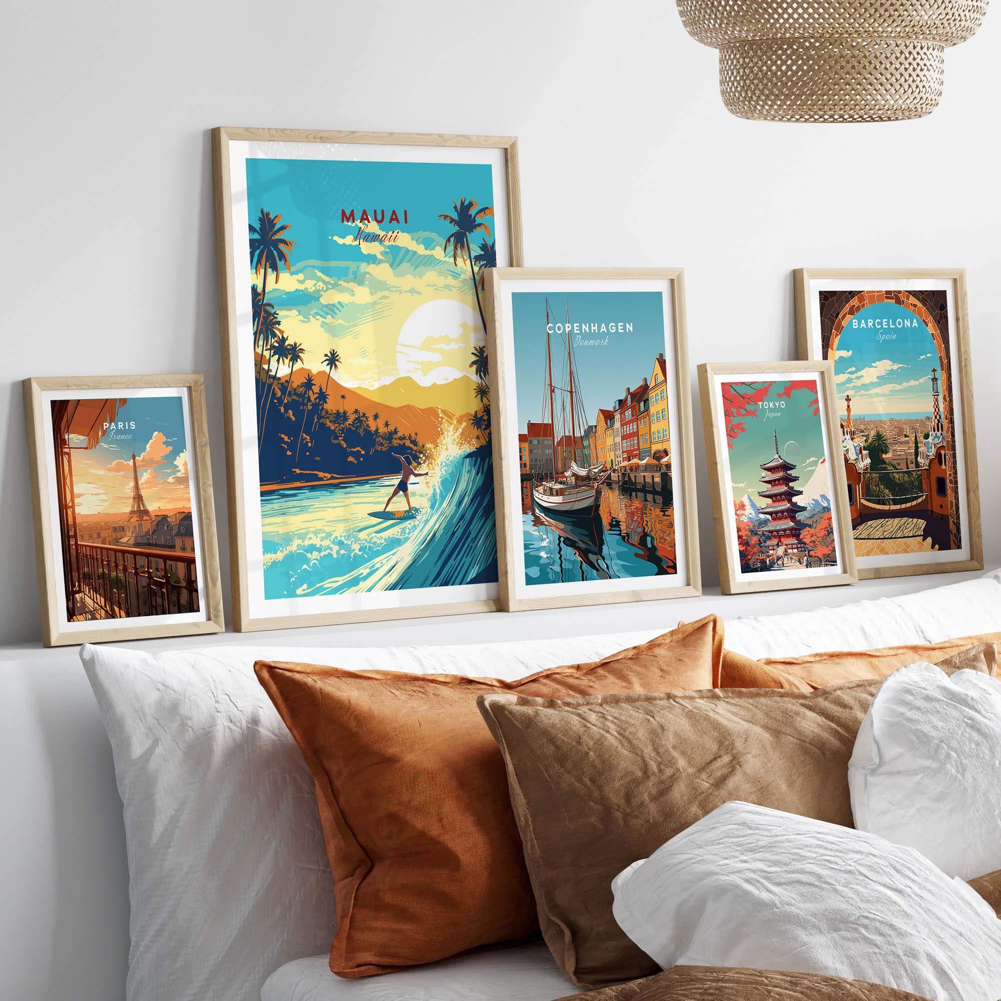Vibrant Maui Hawaii surf print and travel posters displayed on a cozy bed with decorative pillows.