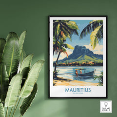 Mauritius Landscape Print - Island Charm Wall Art for Sale framed on a green wall with tropical plants nearby.