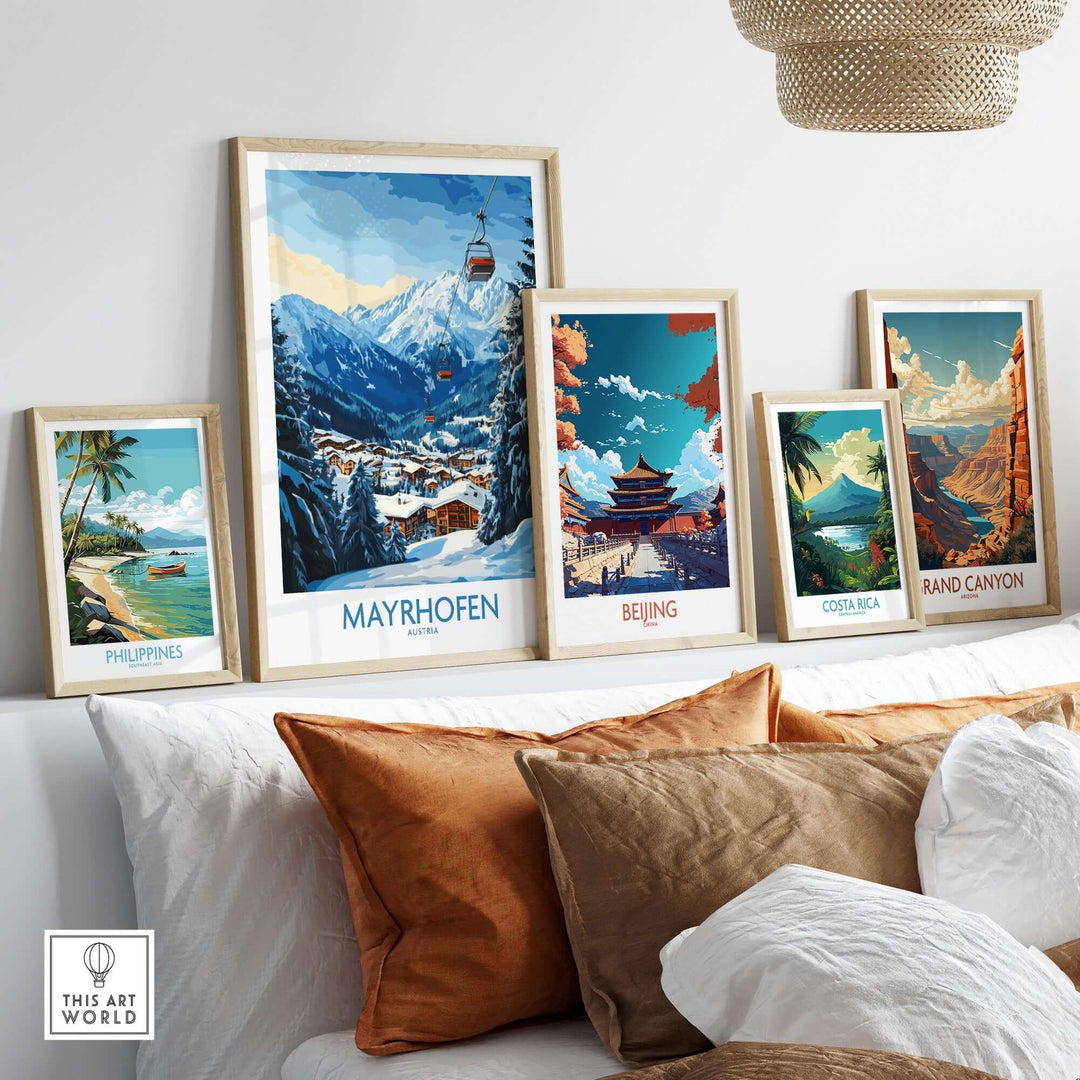 Decorated wall featuring Mayrhofen ski poster and travel art prints from Philippines, Beijing, Costa Rica, and Grand Canyon.