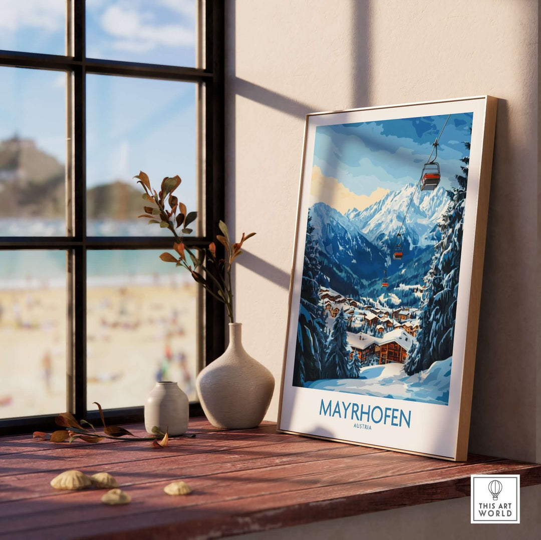 Mayrhofen ski poster displayed in a bright room with a view of mountains, showcasing beautiful winter scenery and ski slopes.