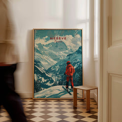 Megève Ski Poster - France displayed in a stylish room with a skier overlooking snow-covered mountains.