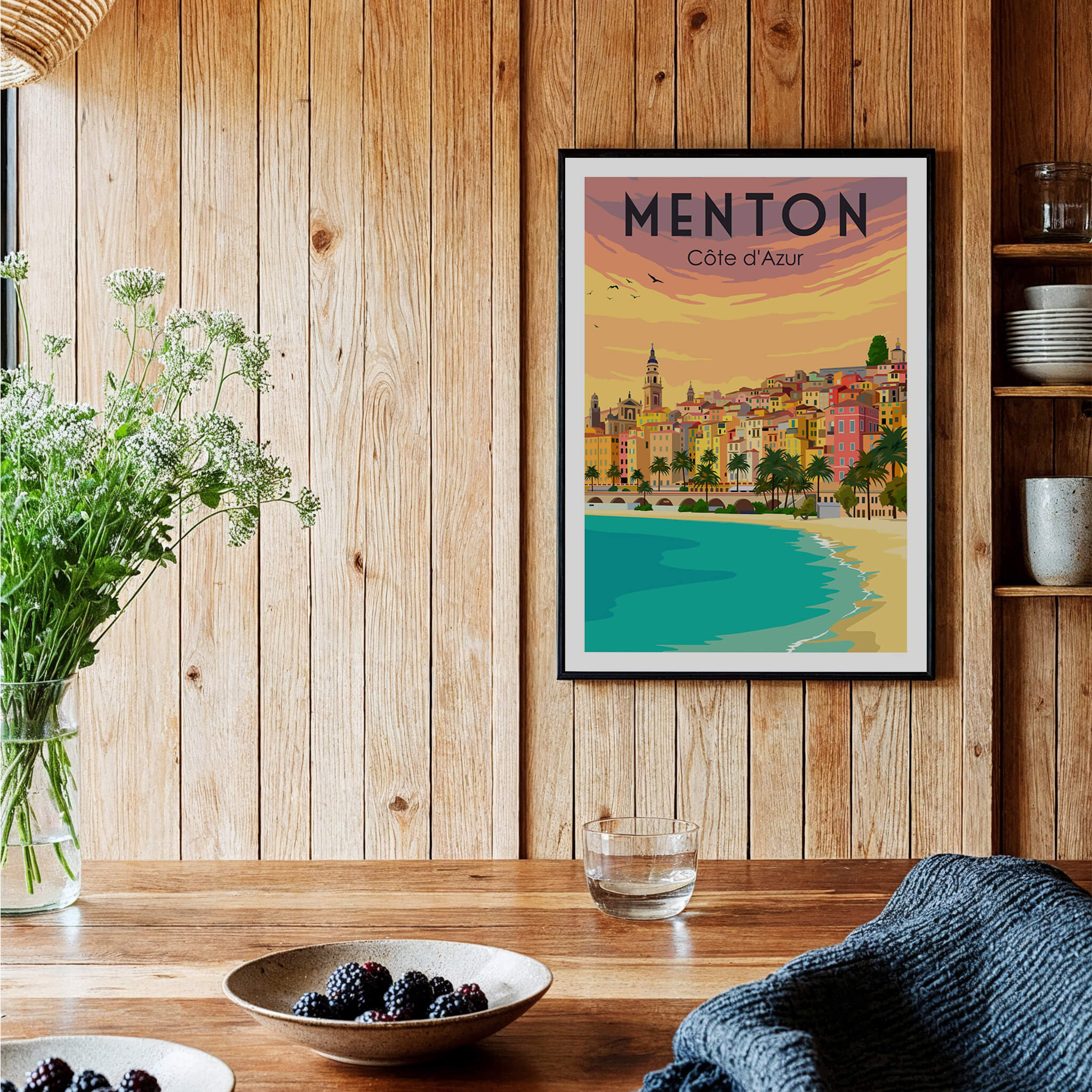 Menton France Print Poster | Vintage displayed on a wooden wall with coastal scenery and flowers in a cozy interior.