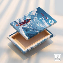 Meribel Travel Poster - France, featuring a vibrant ski scene and mountain backdrop on an art box.
