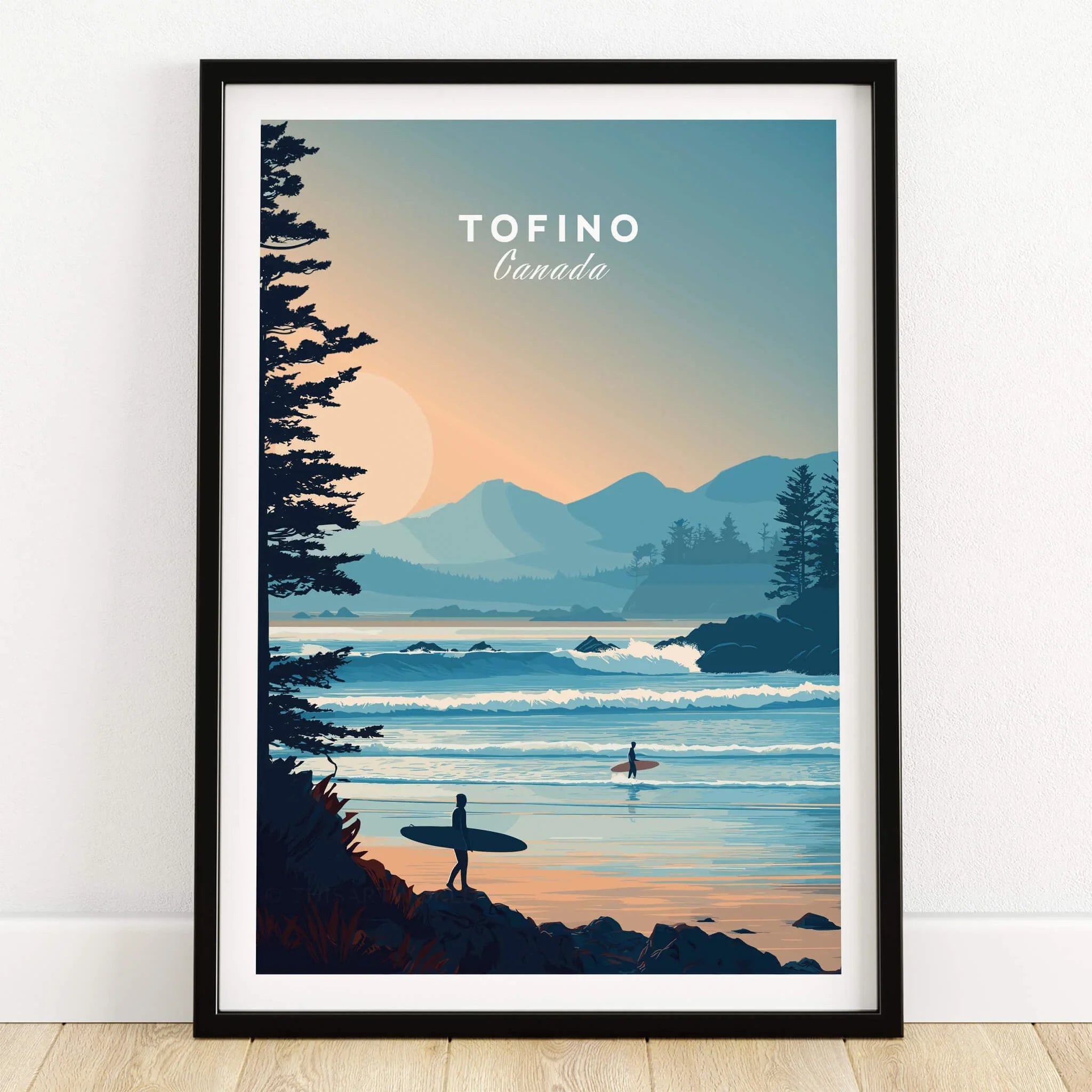 Tofino Canada art print with surfers, sunset coastline, and mountains in black frame.
