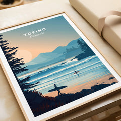 Tofino Canada travel poster art print with surfers, ocean waves, and mountain sunset in a natural wood frame, unwrapped as a gift.
