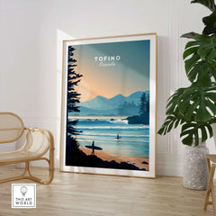 Framed Tofino Canada travel poster with surfers and coastal landscape in modern living room.