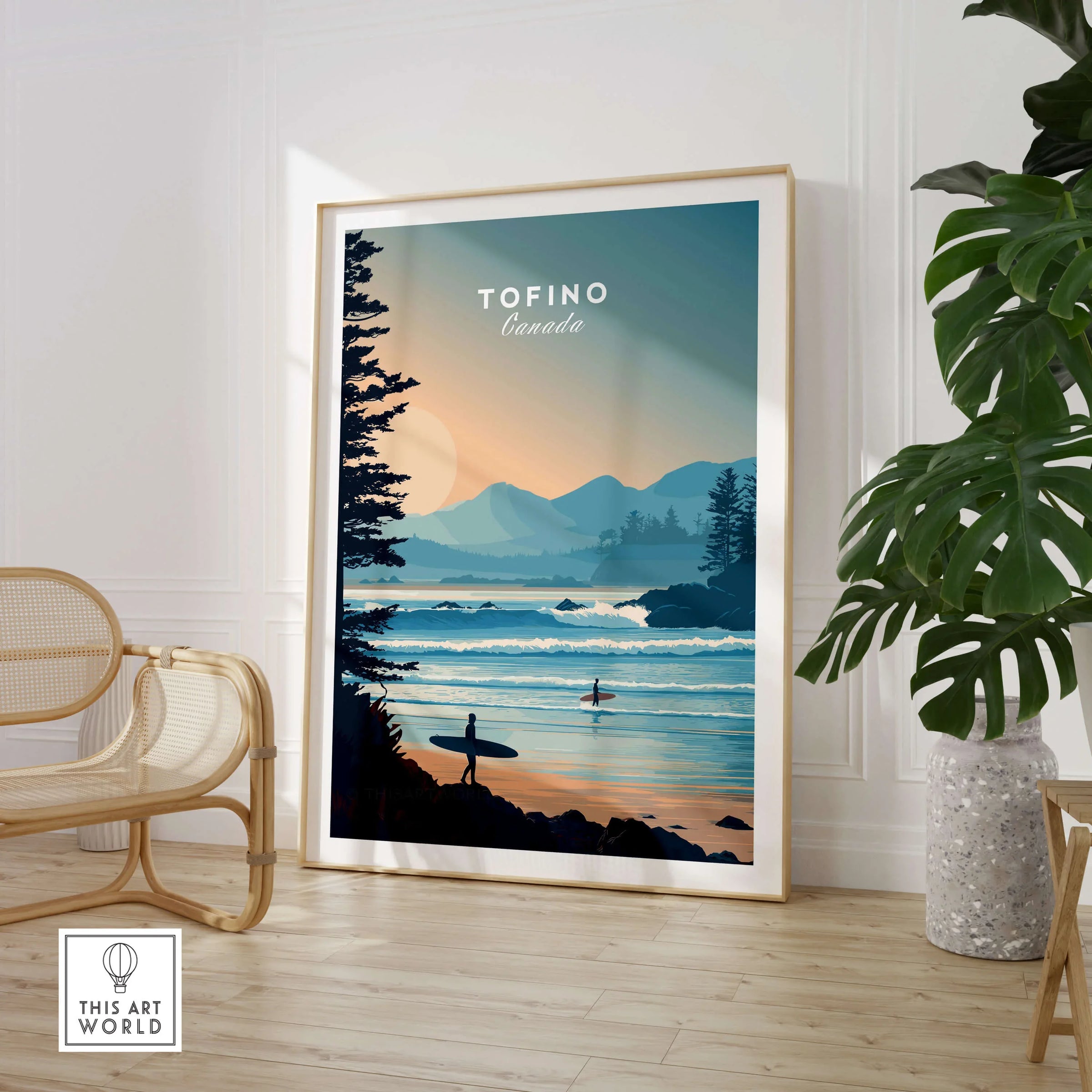 Framed Tofino Canada travel poster with surfers and coastal landscape in modern living room.