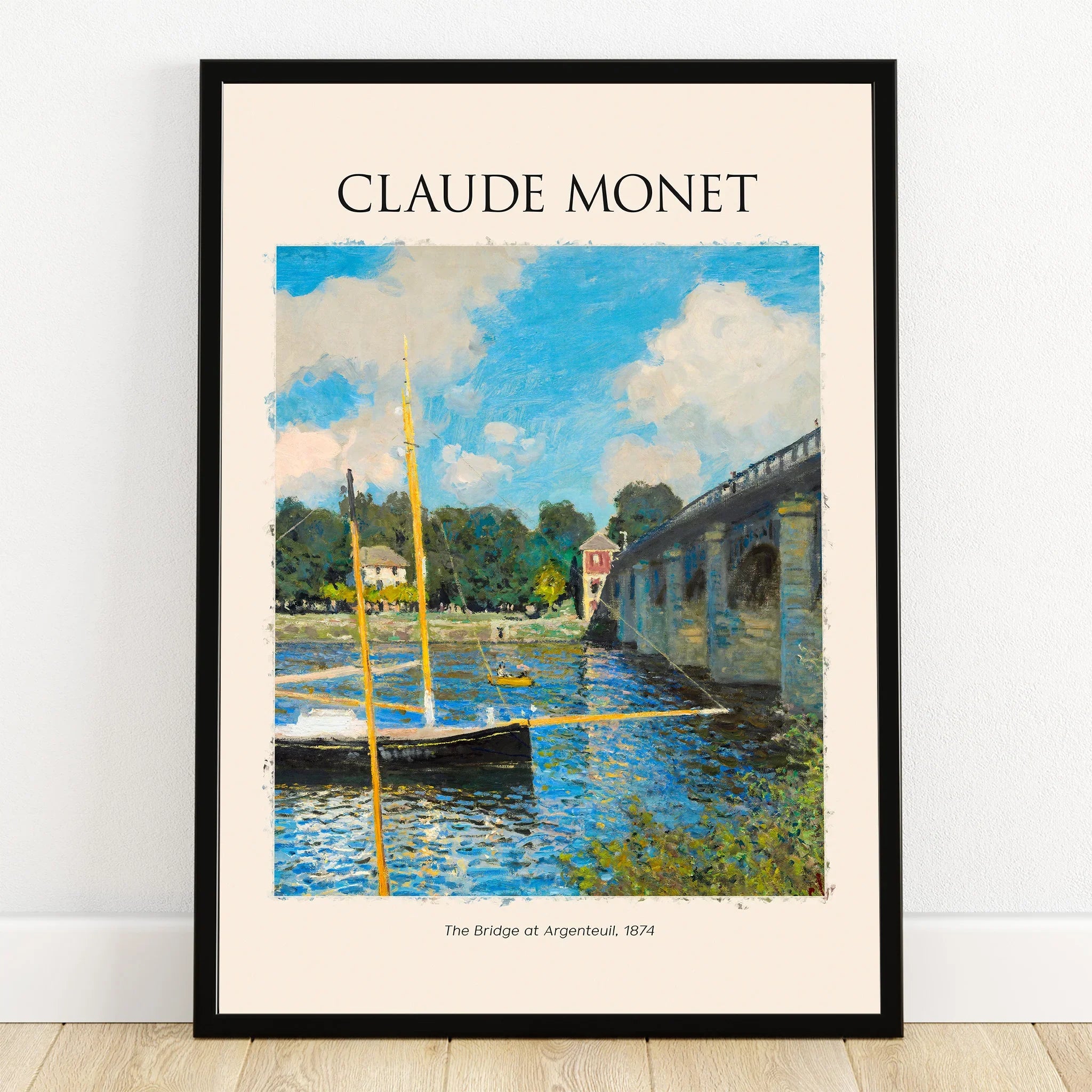 Framed Claude Monet art print of The Bridge at Argenteuil with boats and blue sky