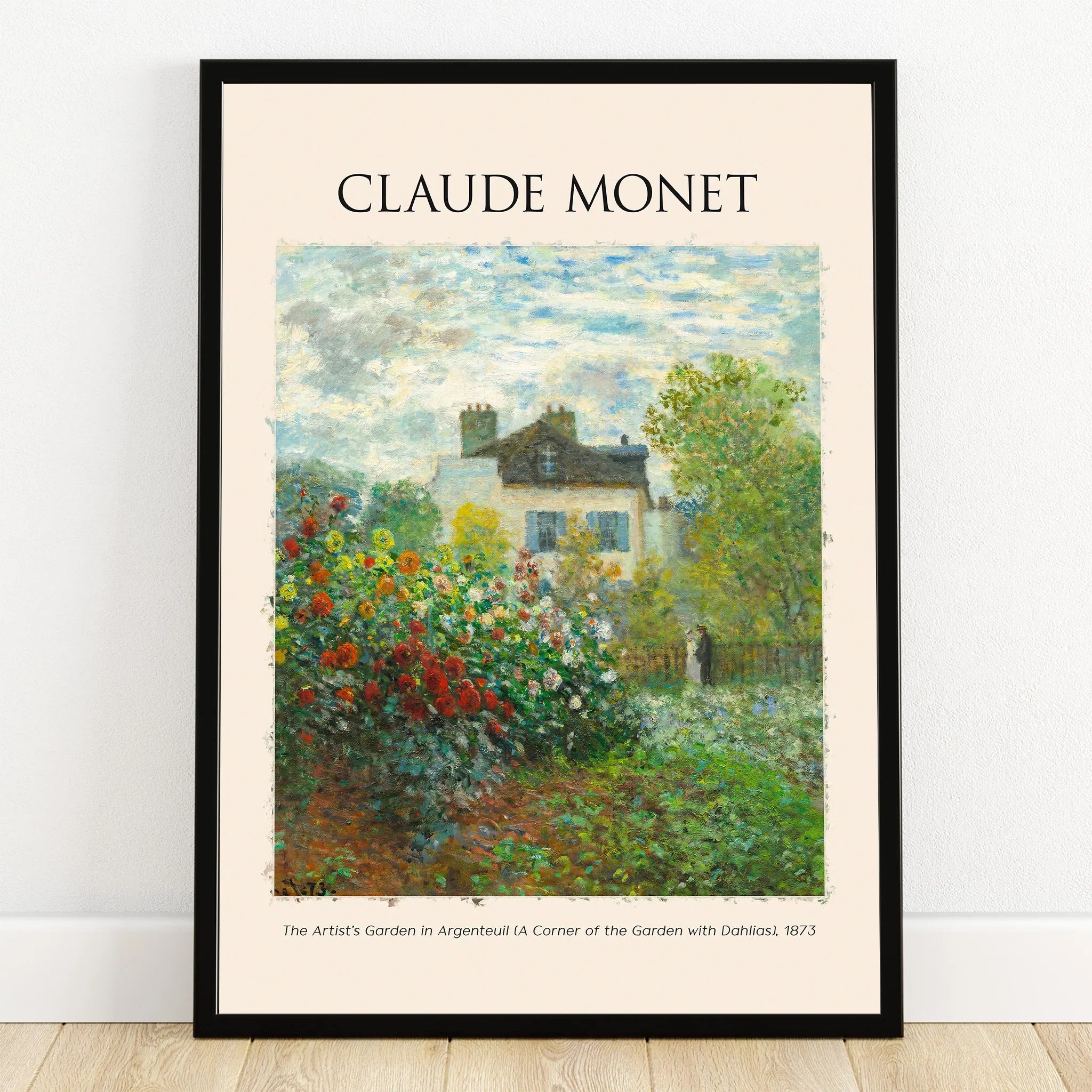 Monet art print in black frame featuring a garden scene with flowers and a house.
