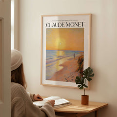 Monet Beach Artwork - Impressionist Room Decor - Coastal Sunset Stroll Beach Wall Art displayed in a cozy room.