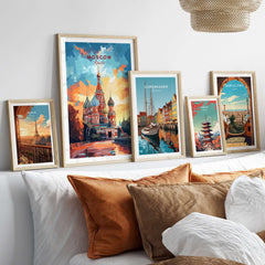 Moscow Wall Art - St. Basil's Travel Poster displayed in frames on a cozy sofa, showcasing travel-themed decor.