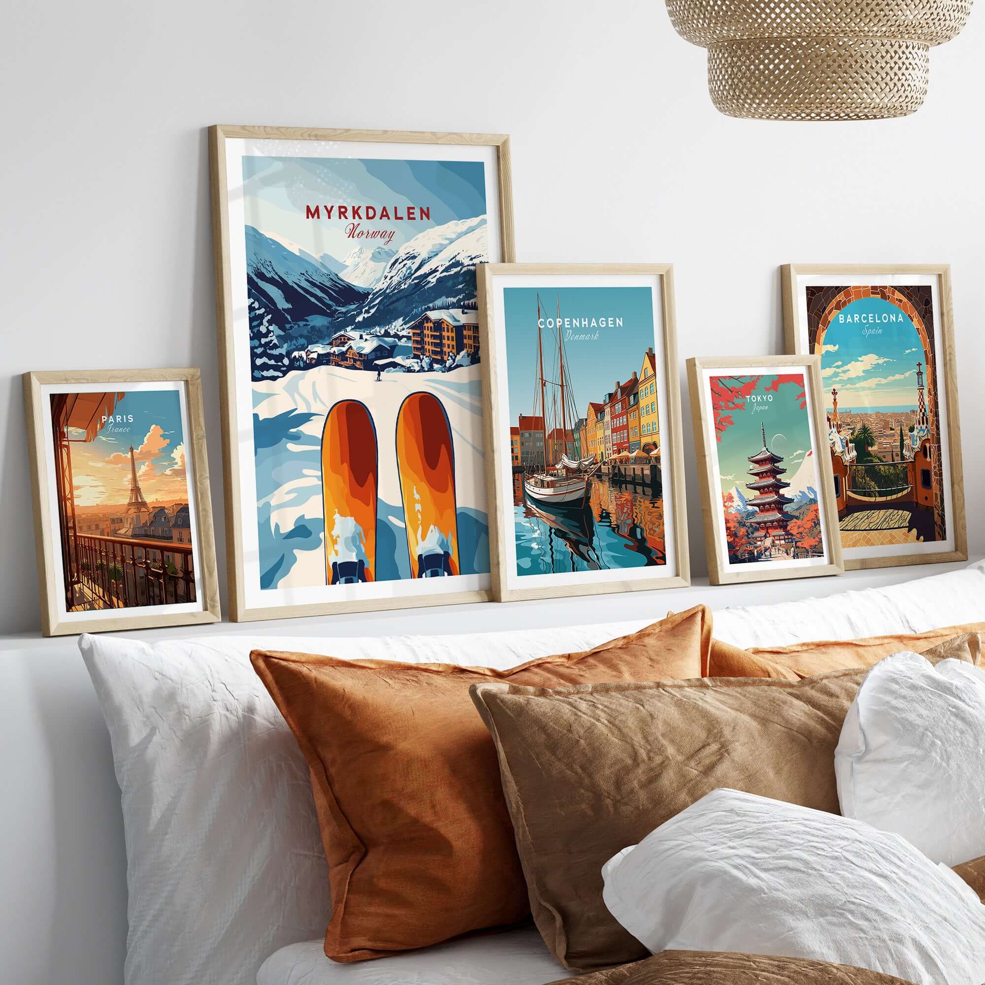 Myrkdalen Norway Print displayed with other travel artwork on a cozy bed, enhancing winter decor.