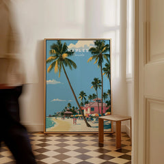 Naples Florida Beachfront Travel Poster — framed canvas on floor man walking past
