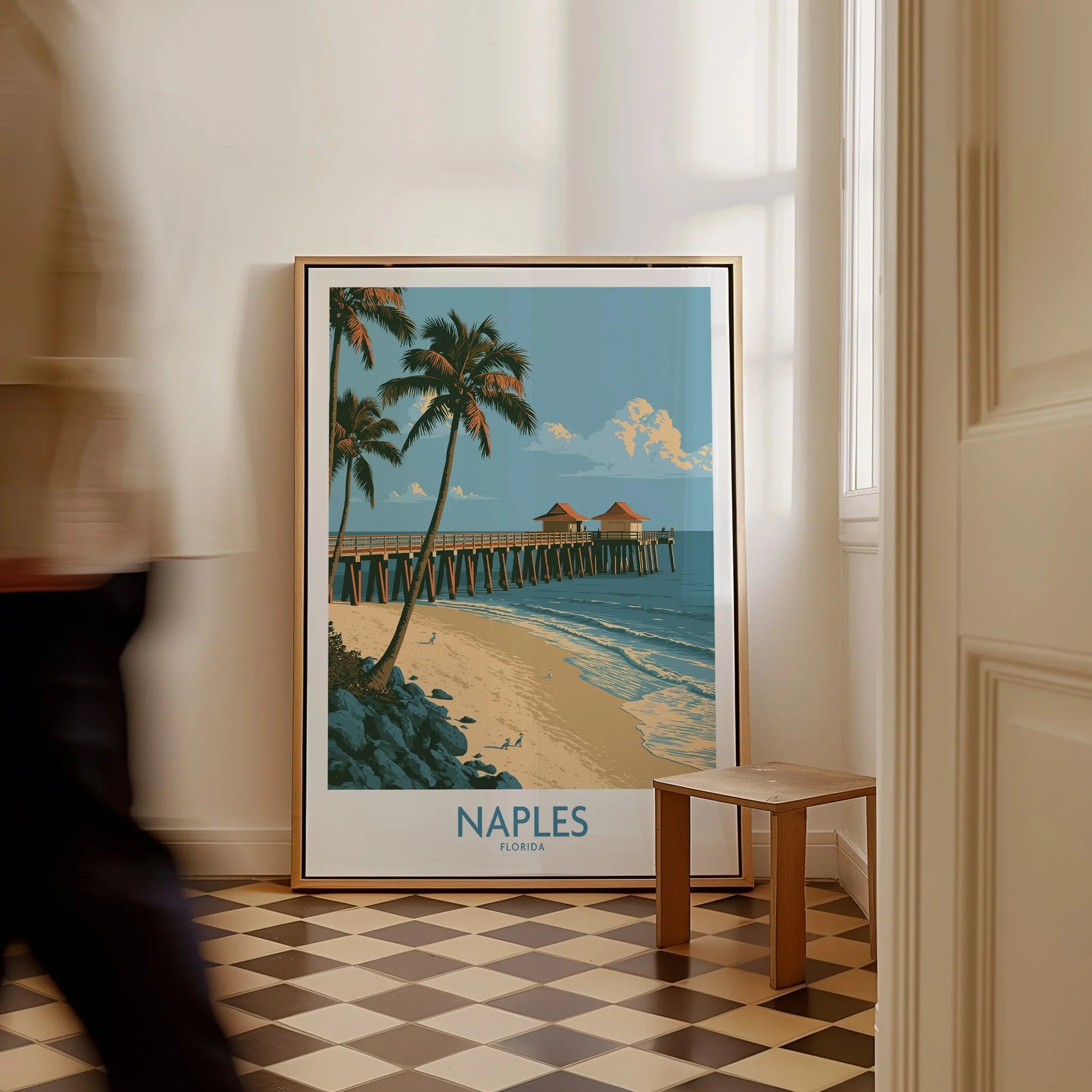 Naples Florida Coast Wall Art — framed canvas on floor man walking past