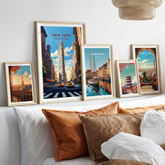 New York City print featuring the Flatiron Building, displayed with other city prints on a stylish bed.