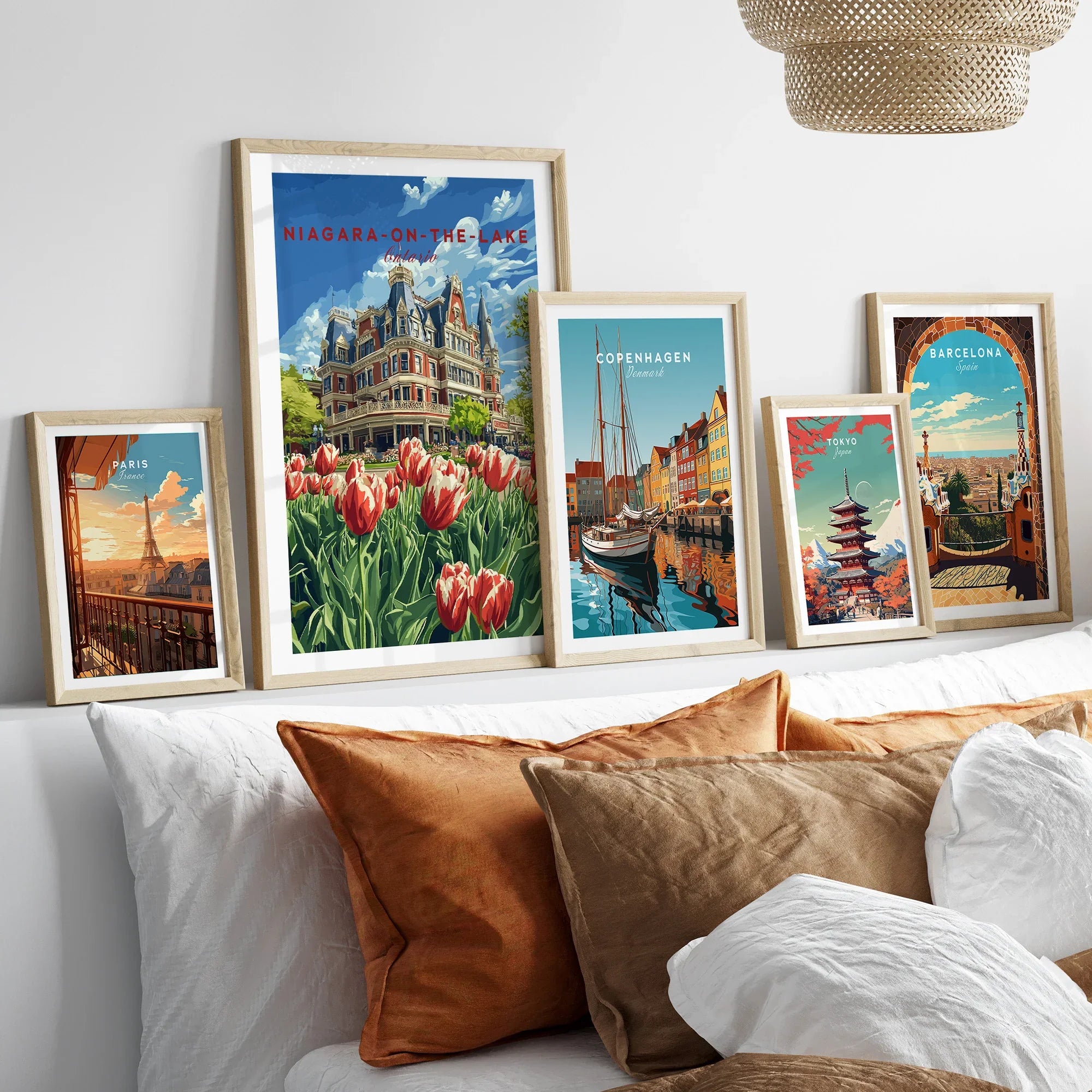 Framed travel posters of Paris, Niagara-on-the-Lake, Copenhagen, Tokyo, and Barcelona for wall art decor