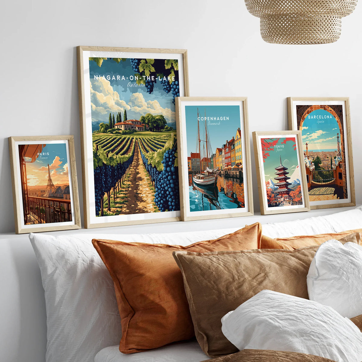 Framed travel posters of Paris, Niagara-on-the-Lake, Copenhagen, Tokyo, and Barcelona for wall art decor