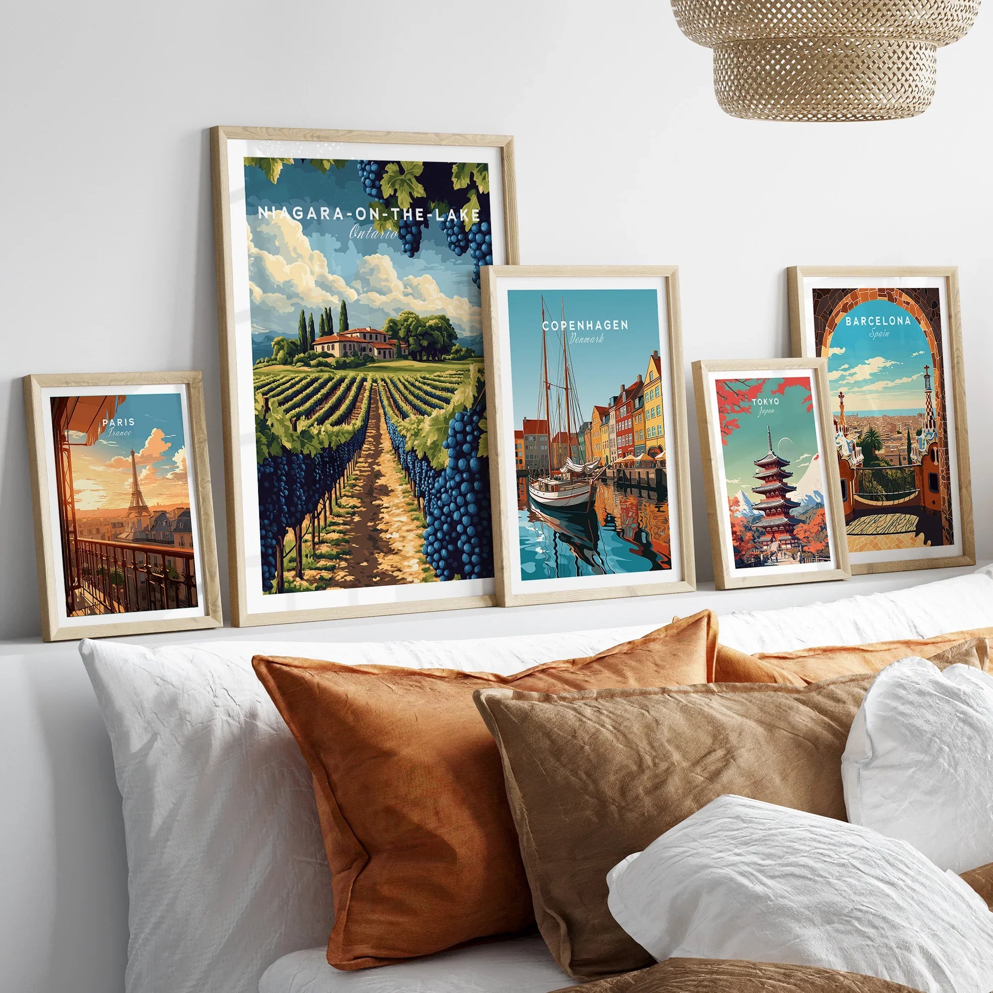 Framed travel posters of Paris, Niagara-on-the-Lake, Copenhagen, Tokyo, and Barcelona for wall art decor