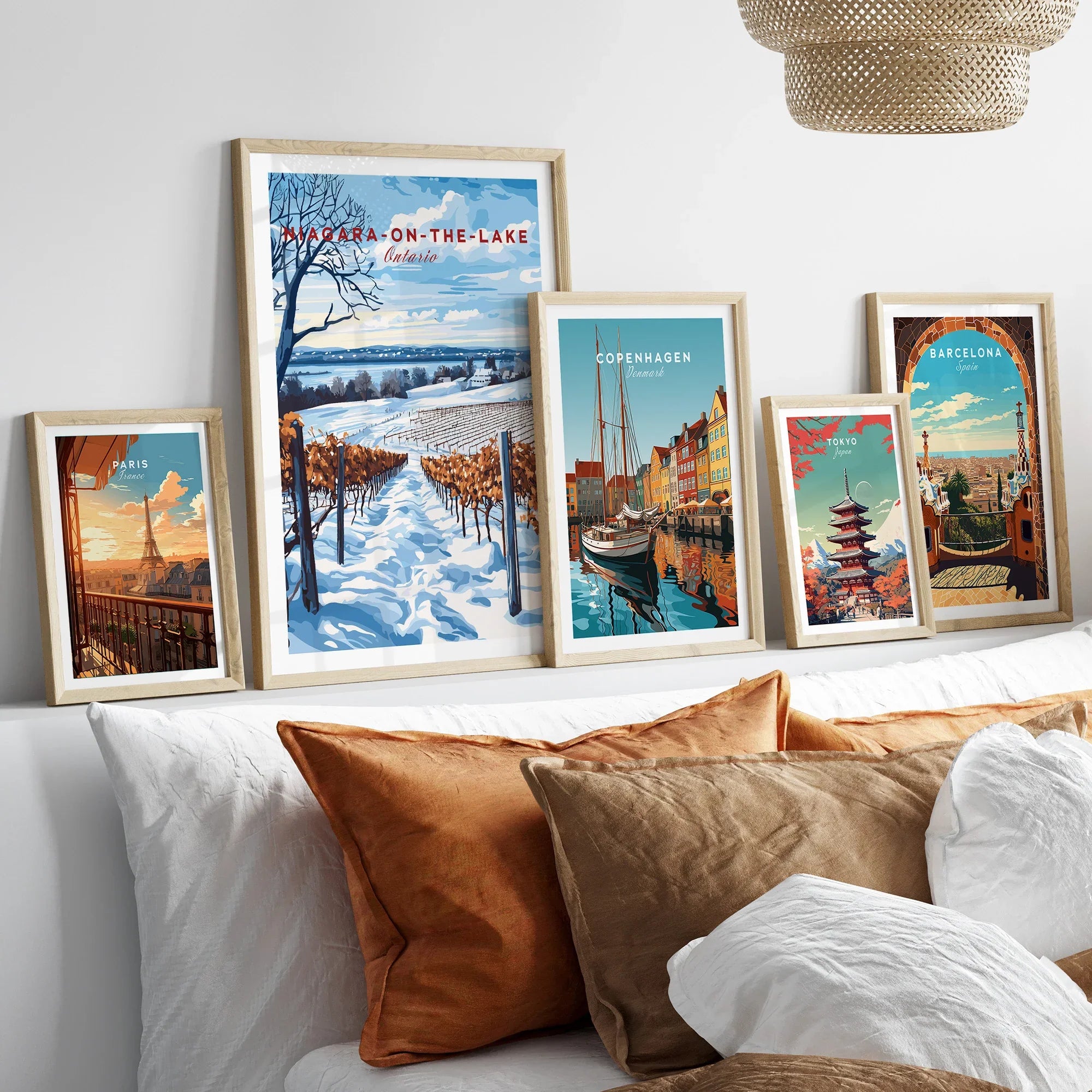 Framed travel posters of Paris, Niagara-on-the-Lake, Copenhagen, Tokyo, and Barcelona for wall art decor