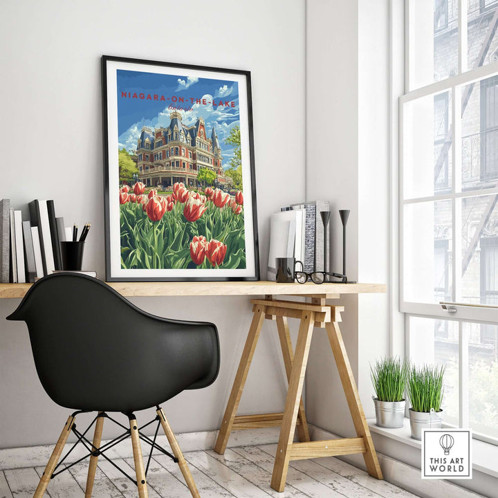 Framed Niagara-on-the-Lake poster featuring vibrant tulips and historic architecture in a modern workspace.