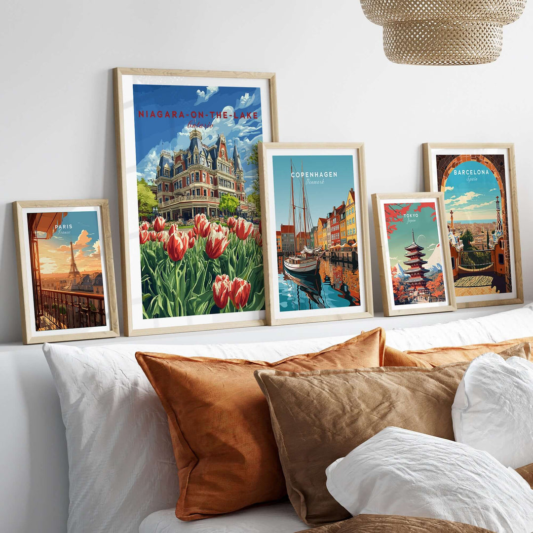 Framed Niagara-on-the-Lake poster with vibrant tulips, displayed among travel-themed art prints in a cozy home setting.