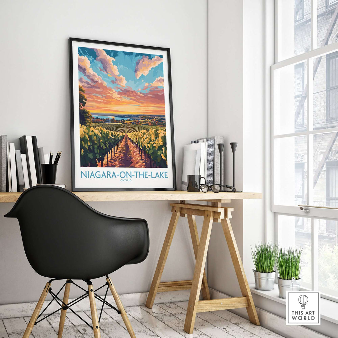 Niagara-on-the-Lake travel poster in a stylish office setting, showcasing vineyards and a sunset view.