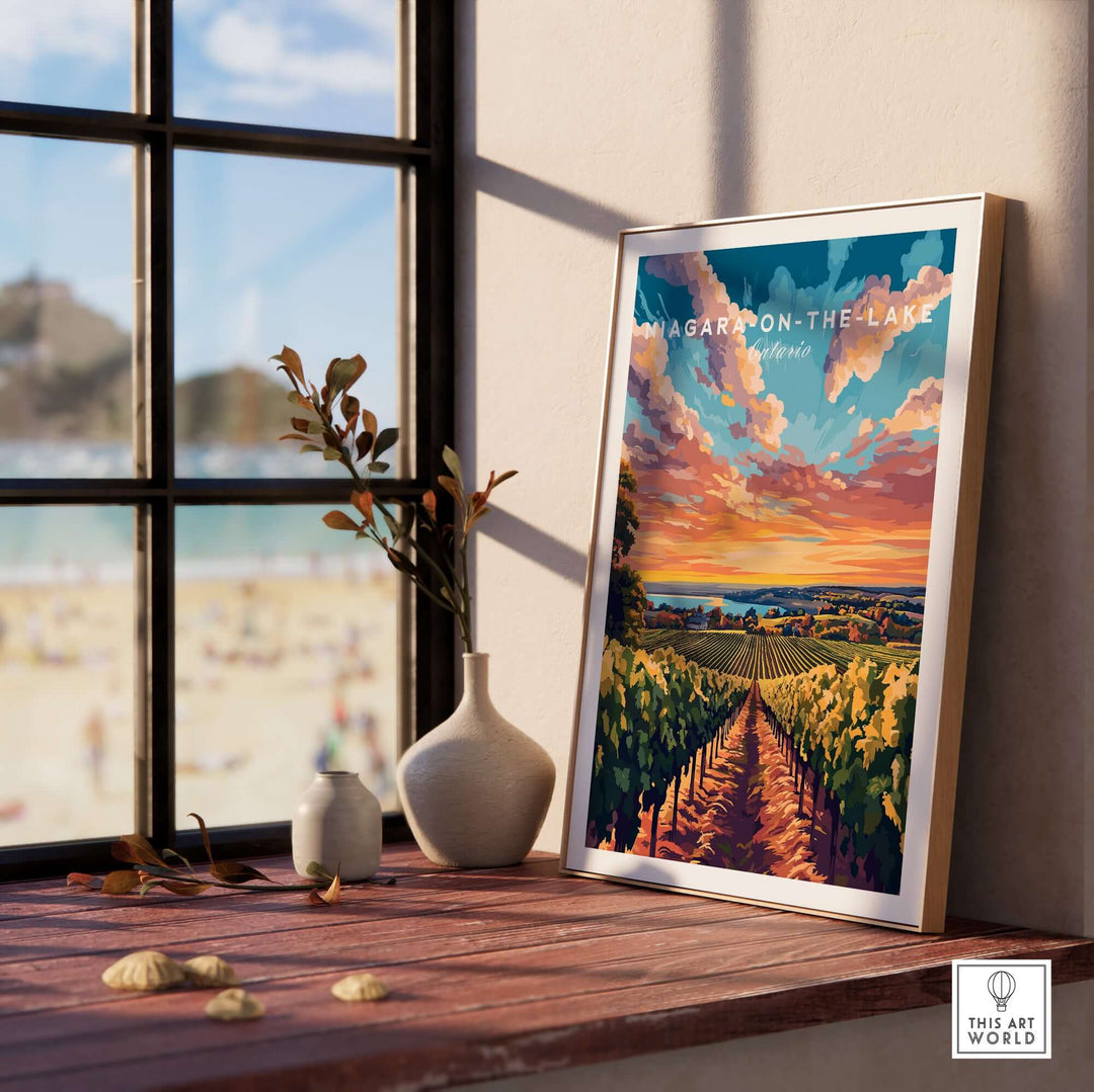 Framed Niagara-on-the-Lake wall art showcasing vibrant sunset over vineyards next to a beach.