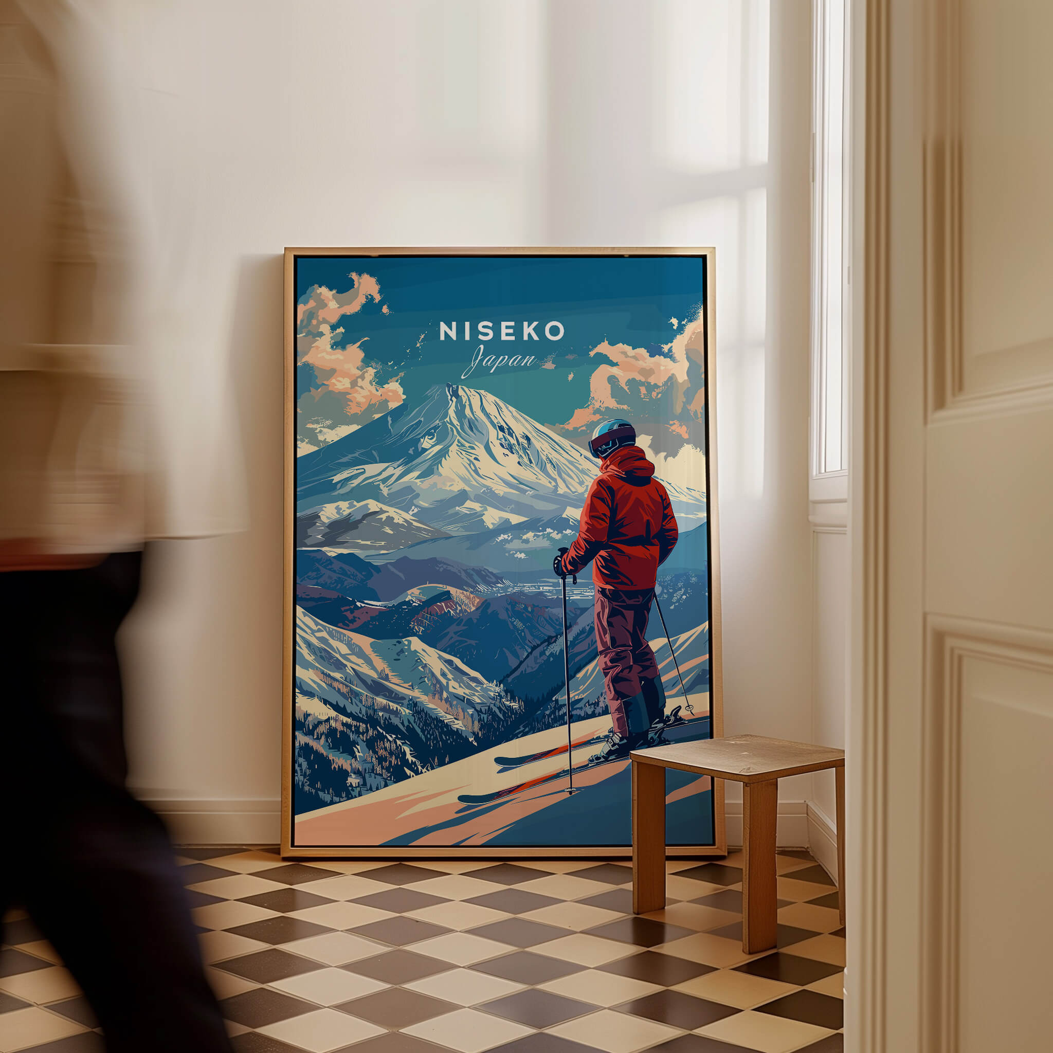 Niseko Wall Art - Japan featuring a skier against a backdrop of snowy mountains in a stylish interior setting.