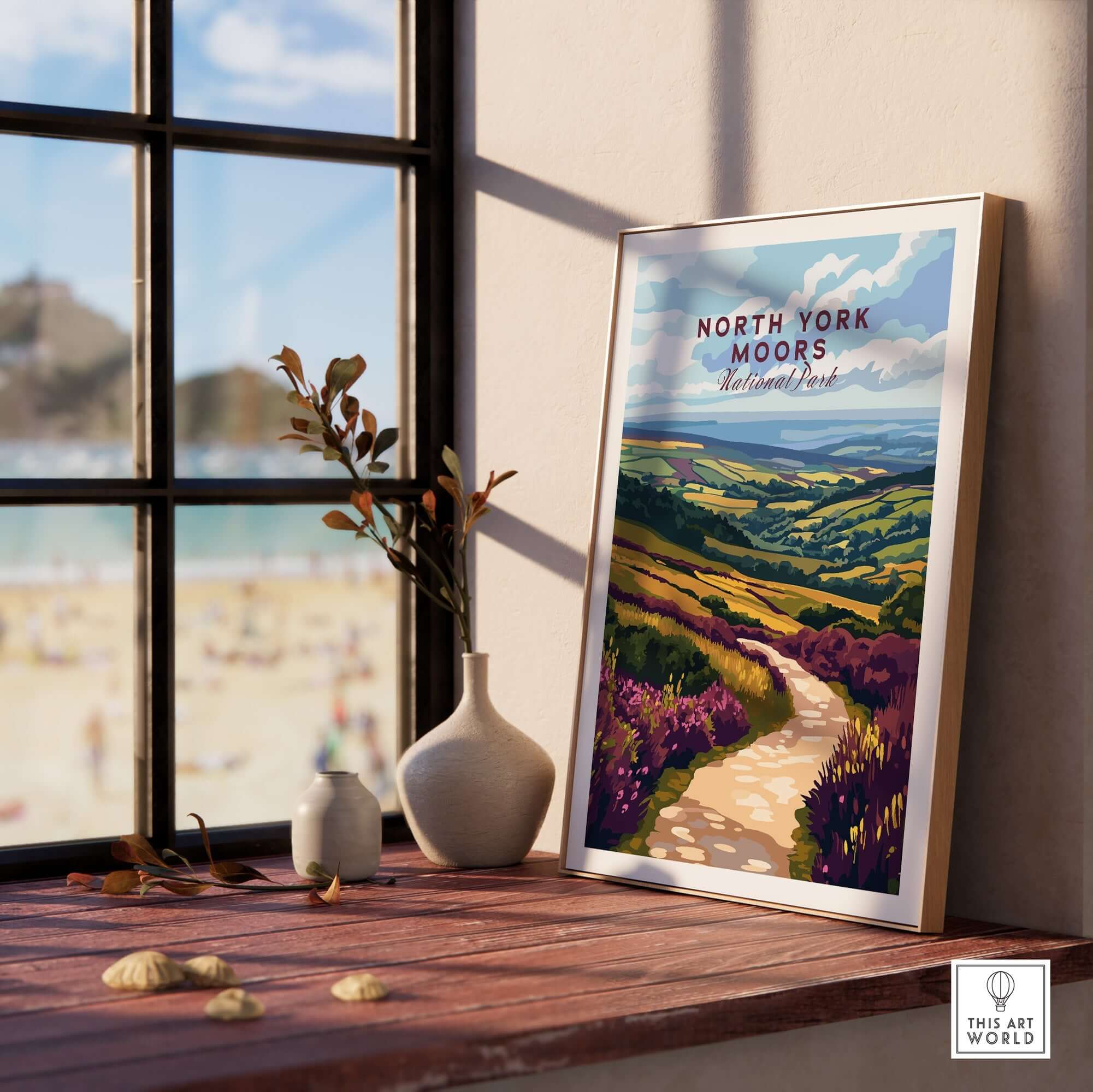 North York Moors Art Print displayed on a wooden table with a scenic landscape background.