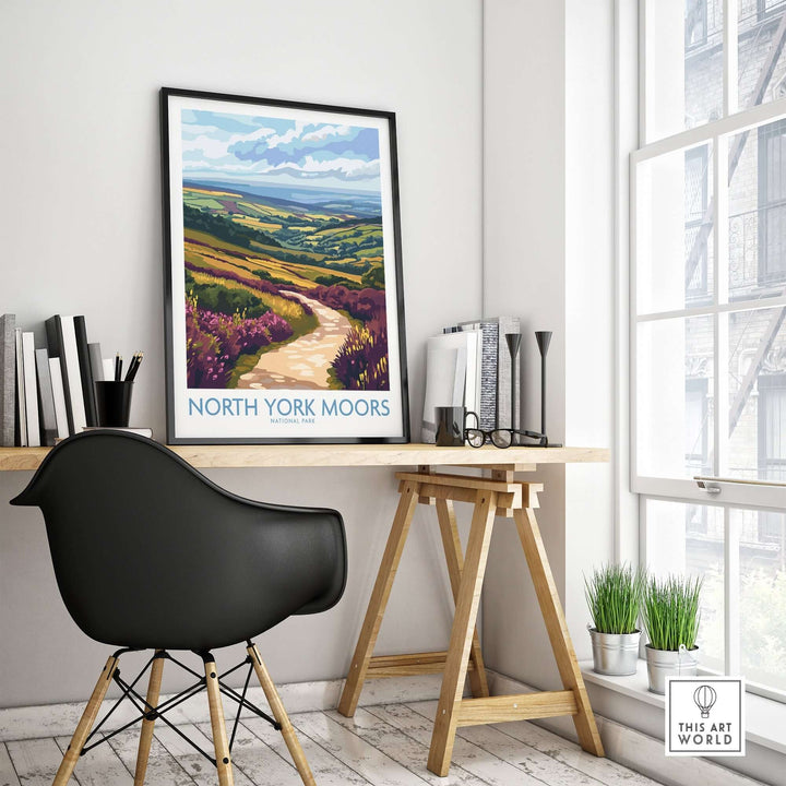 North York Moors poster displayed on a wall above a modern desk, showcasing vibrant landscapes and nature inspiration.