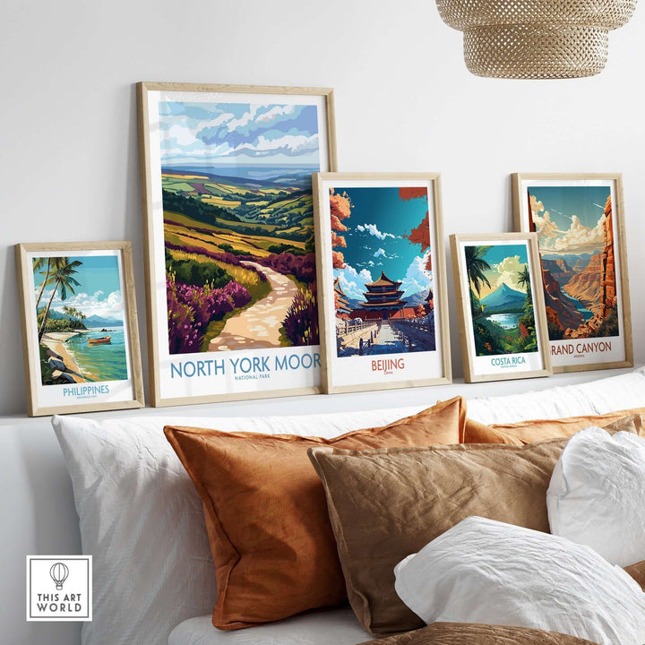 Colorful travel posters displayed in a cozy living room, featuring North York Moors, Beijing, the Grand Canyon, and more.