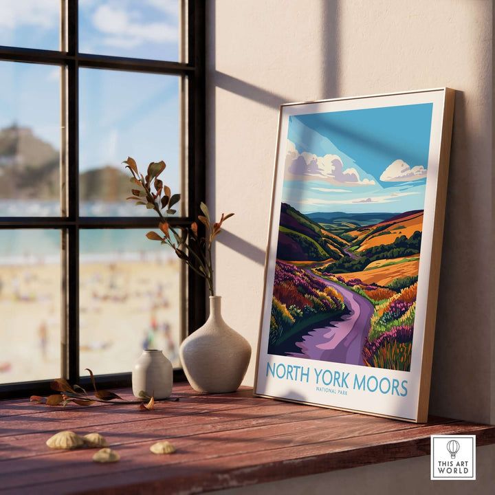 Vibrant North York Moors National Park wall art displayed on a windowsill, showcasing colorful landscapes and serene views.