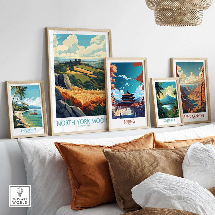 North York Moors poster framed among vibrant travel art pieces on a stylish sofa, adding a touch of nature to home decor.