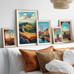 North York Moors Print showcased among various framed travel art prints on a stylish bed.