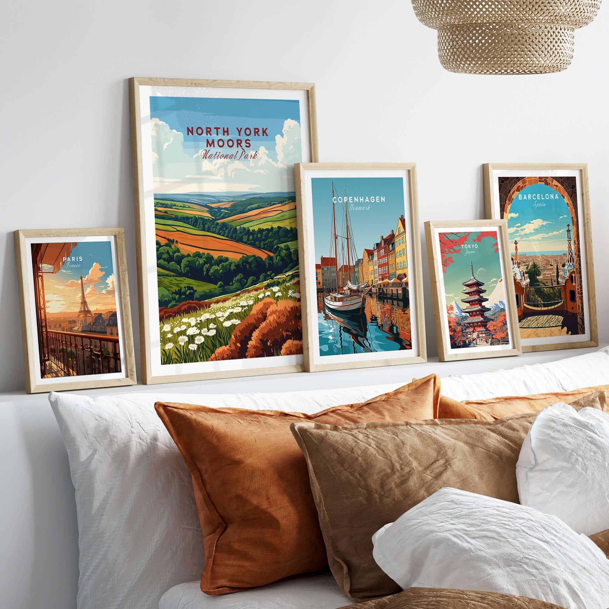 North York Moors Travel Print displayed among other travel prints in a cozy living room setting with decorative pillows.