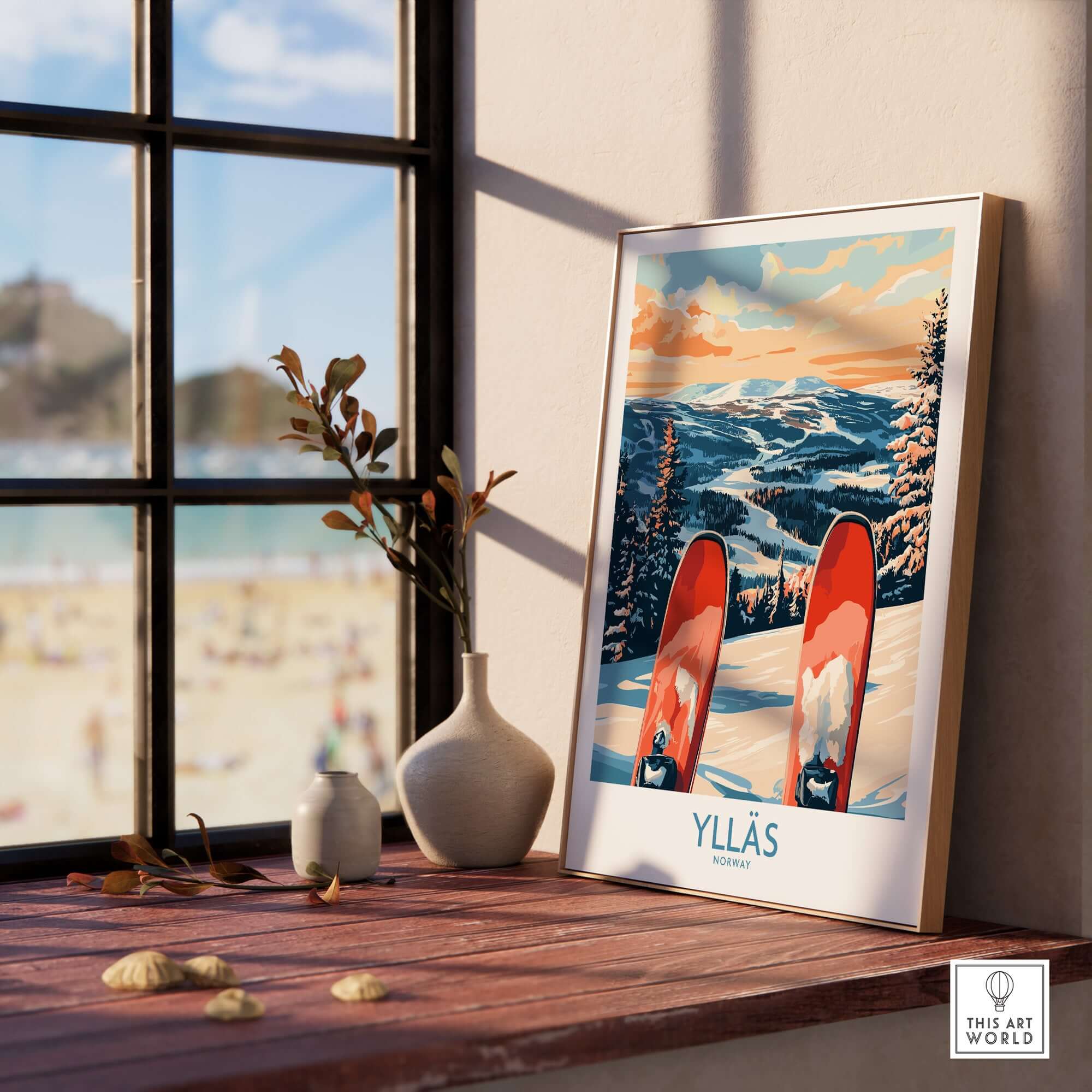 Framed Ylläs Norway ski print on a window sill, showcasing a serene winter scene with vibrant colors.