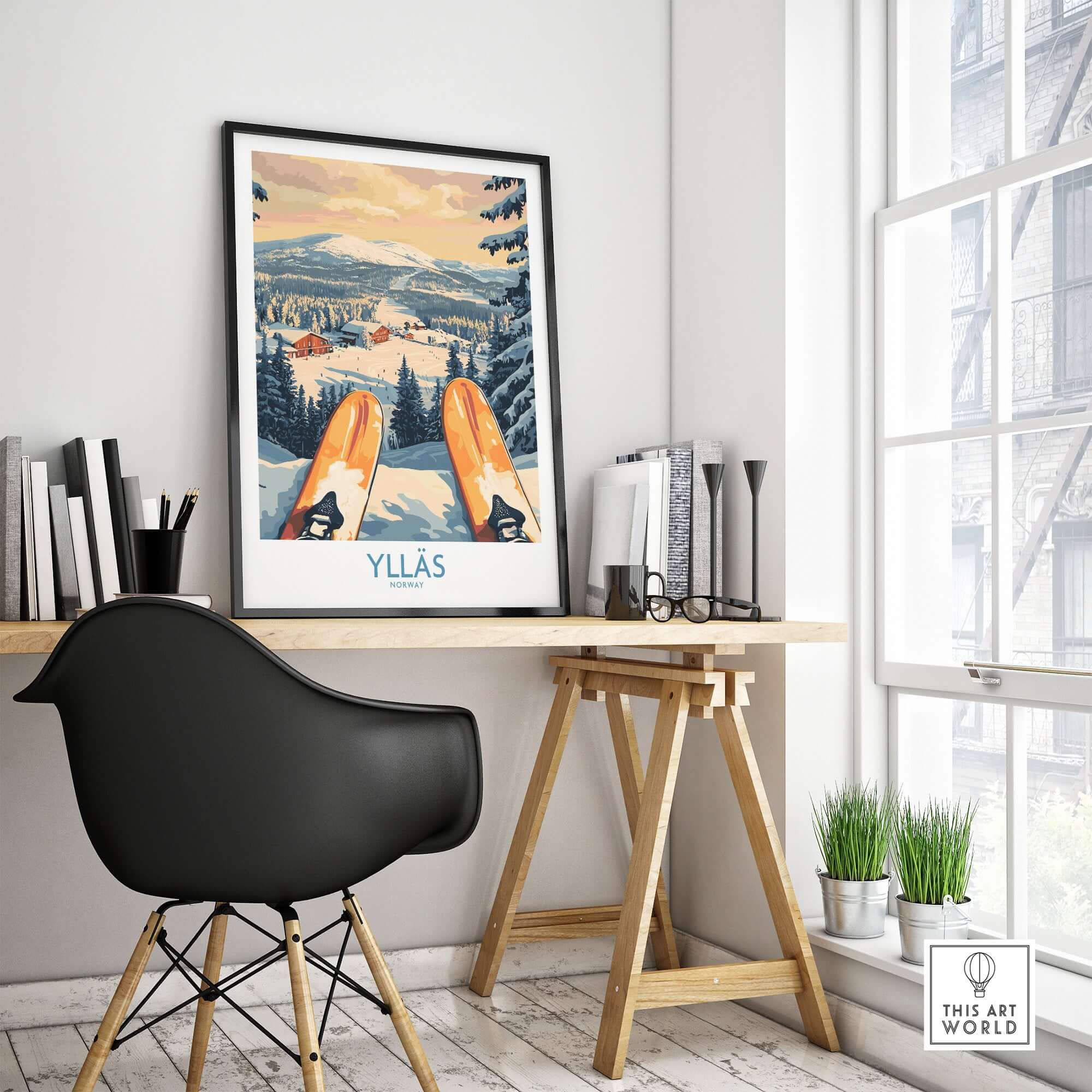 Ylläs snowy cabin print displayed in a cozy workspace, showcasing a winter skiing scene from Norway.