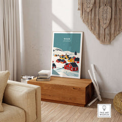 Nuuk Greenland Print showcasing a vibrant illustration of Nuuk's colorful houses in a cozy interior setting.