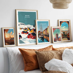 Nuuk Greenland Print displayed among other city prints in a cozy living room setting with decorative cushions.