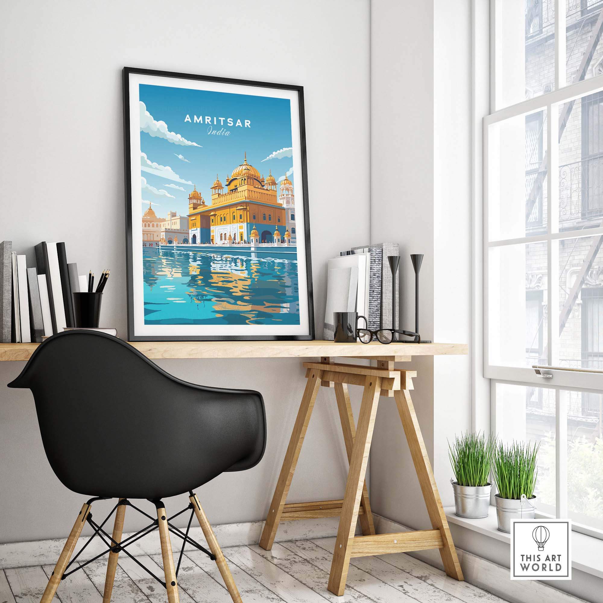 Amritsar India travel poster print displayed in a modern workspace showcasing the Golden Temple.