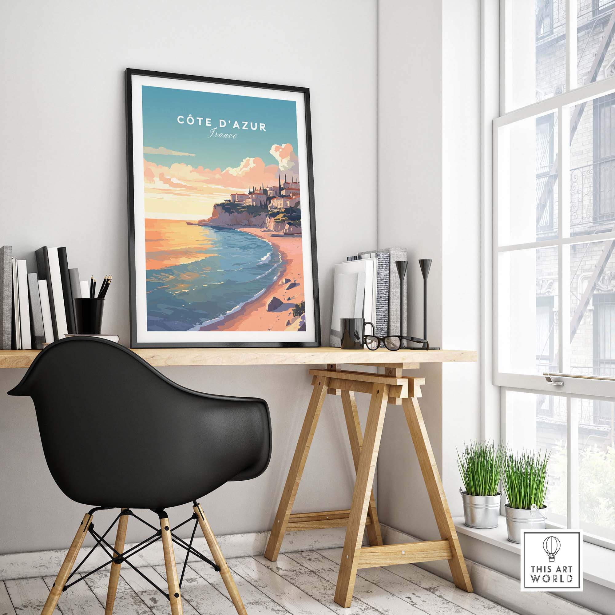 Côte d'Azur travel poster print displayed in modern workspace, capturing vibrant French coast beauty.